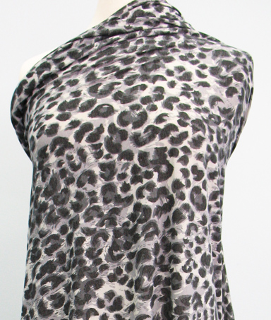 polyester rayon ITY knit in gray black white animal print fabric by the yard